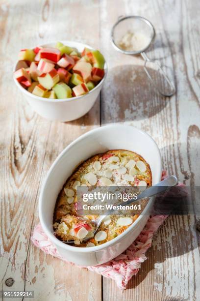 clafoutis with rhubarb and sliced almonds - clafoutis stock pictures, royalty-free photos & images