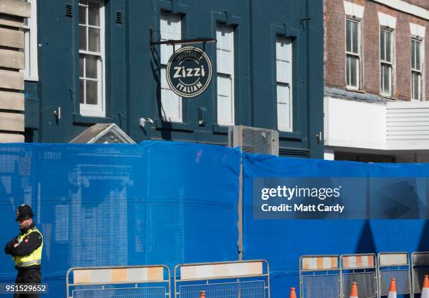 The Zizzi restaurant remains closed as members of the military work in the Maltings shopping area nearby, close to the bench where Russian former...