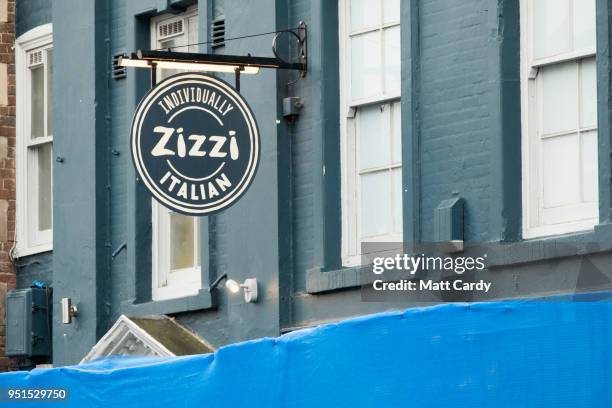 The Zizzi restaurant remains closed as members of the military work in the Maltings shopping area nearby, close to the bench where Russian former...