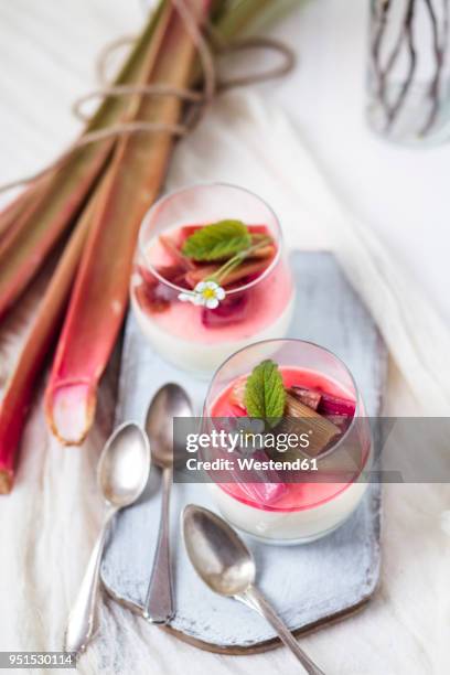 glasses of panna cotta with roasted rhubarb - ルバーブ ストックフォトと画像