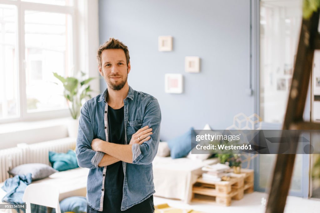Portrait of smiling man at home