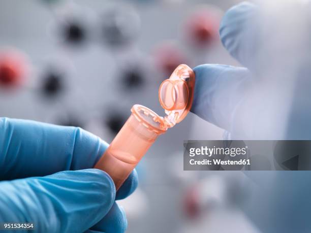 scientist closing the eppendorf tube - eppendorf tube stock pictures, royalty-free photos & images