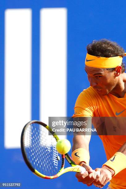 Spain's Rafael Nadal returns the ball to Spain's Guillermo Garcia-Lopez during their Barcelona Open ATP tournament tennis match in Barcelona on April...