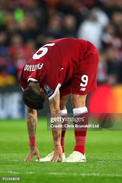 Roberto Firmino of Liverpool reacts during the UEFA Champions League Semi Final First Leg match between Liverpool and A.S. Roma at Anfield on April...