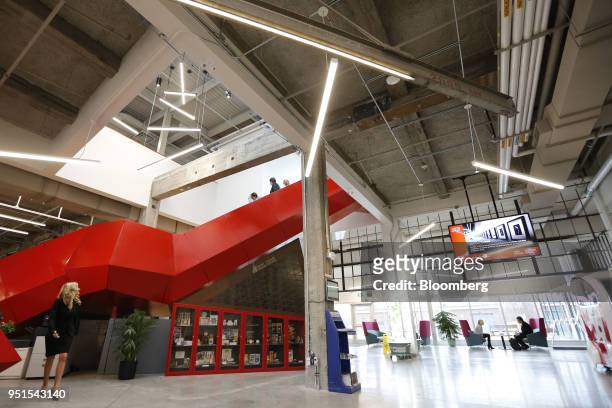 Tenants walk through the lobby at the Bayview Yards innovation center in Ottawa, Ontario, Canada, on Wednesday, April 25, 2018. Bayview Yards is a...