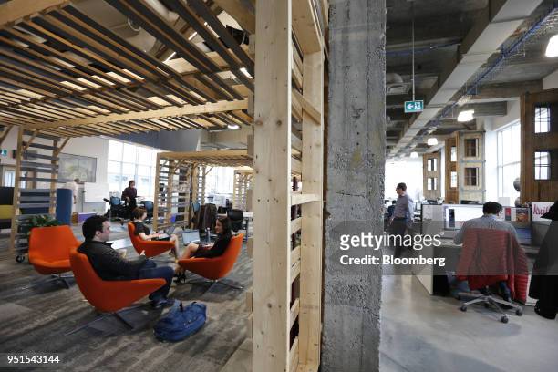 Tenants work at the Bayview Yards innovation center in Ottawa, Ontario, Canada, on Wednesday, April 25, 2018. Bayview Yards is a...