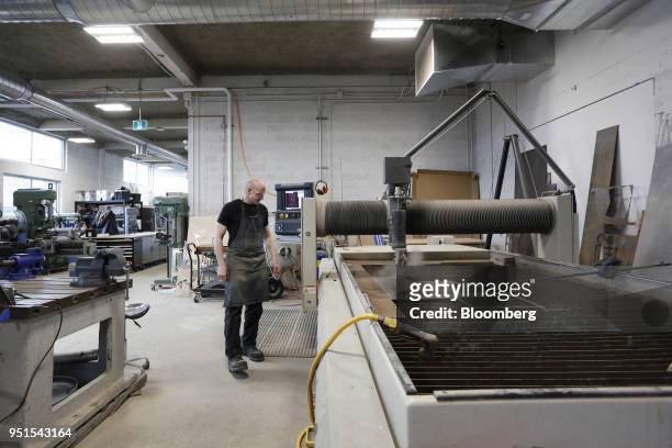 Technician operates a water jet cutter in the maker space of the Bayview Yards innovation center in Ottawa, Ontario, Canada, on Wednesday, April 25,...