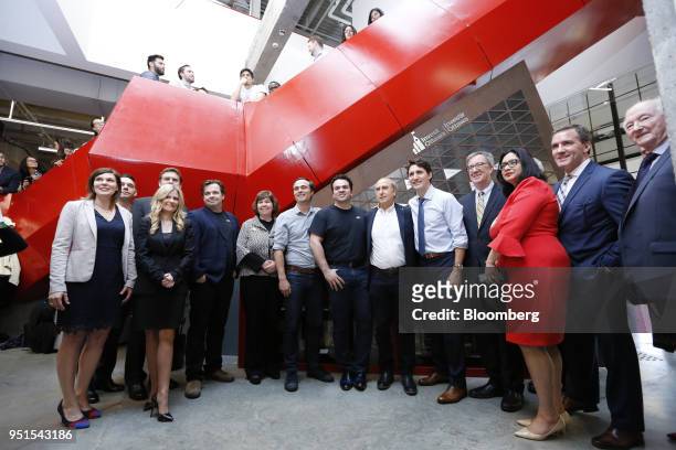 Justin Trudeau, Canada's prime minister, center, stands for a group photograph following a tour of the Bayview Yards innovation center in Ottawa,...