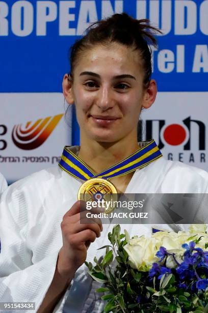 Kosovo's gold medallist Nora Gjakova poses on the podium with her medal after the women's under 57 kilograms weight category competition during the...