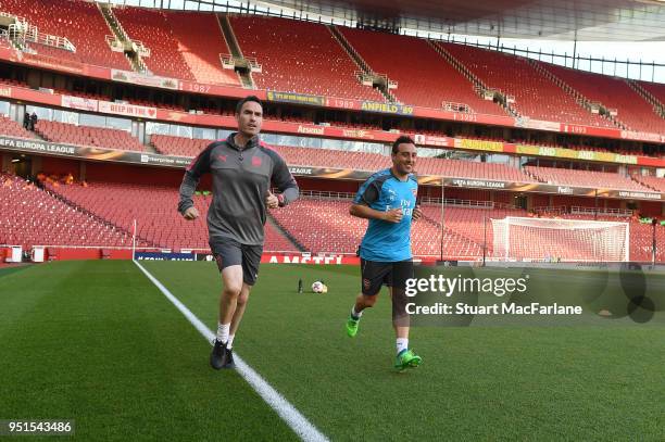 Arsenal's Santi Cazorla with fitness coach Shaf Fosythe before the UEFA Europa League Semi Final leg one match between Arsenal FC and Atletico Madrid...