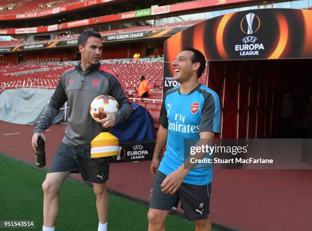 Arsenal's Santi Cazorla with fitness coach Shaf Fosythe before the UEFA Europa League Semi Final leg one match between Arsenal FC and Atletico Madrid...