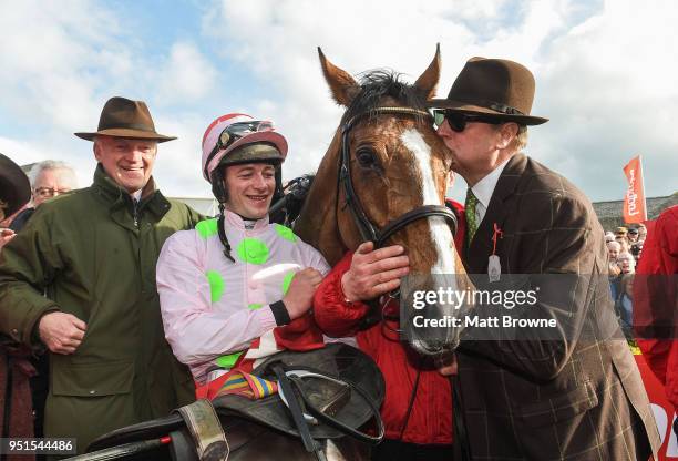 Naas , Ireland - 26 April 2018; Willie Mullins and jockey David Mullins look on as Owner Rich Ricci kisses Faugheen after winning the Ladbrokes...