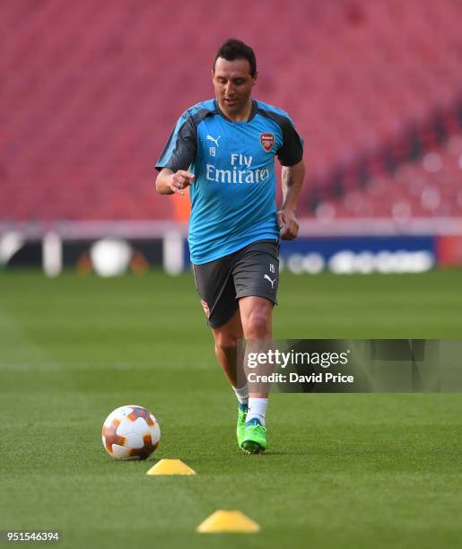 Santi Cazorla of Arsenal trains on the pitch before the UEFA Europa League Semi Final leg one match between Arsenal FC and Atletico Madrid at...