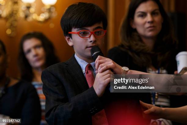 Child asks House Minority Leader Nancy Pelosi a question as she speaks with journalists' kids during her weekly press conference on 'Take our...