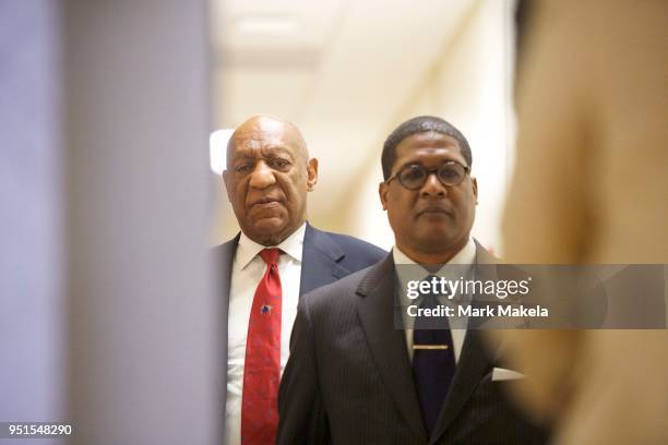 Bill Cosby walks after it was announced a verdict is in at the Montgomery County Courthouse for day fourteen of his sexual assault retrial on April...
