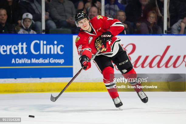 Portland Winterhawks defenseman Henri Jokiharju fires a pass up ice during the second period in Game 5 of the second round of the Western Hockey...