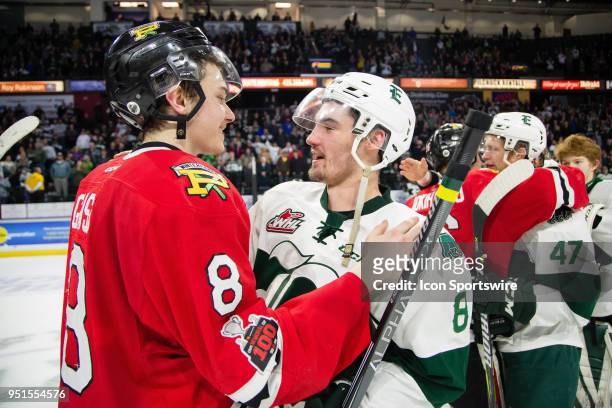 Forward Cody Glass of the Portland Winterhawks shakes hands with Everett Silvertips forward Patrick Bajkov after Game 5 of the second round of the...