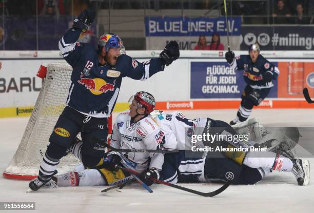 Mads Christensen of EHC Red Bull Muenchen celebrates his team's fourth goal during the DEL Play-offs Final Match 7 between EHC Red Bull Muenchen and...