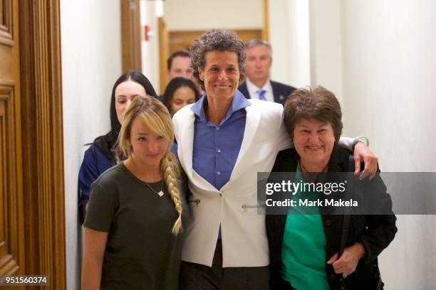 Bill Cosby accuser Andrea Constand reacts with lawyer Dolores Troiani and Delaney Henderson after the guilty on all counts verdict was delivered in...