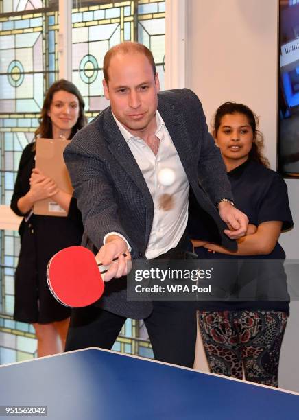 Prince William, Duke of Cambridge, plays table tennis as he attends the opening of the Greenhouse Sports Centre on April 26, 2018 in London, United...