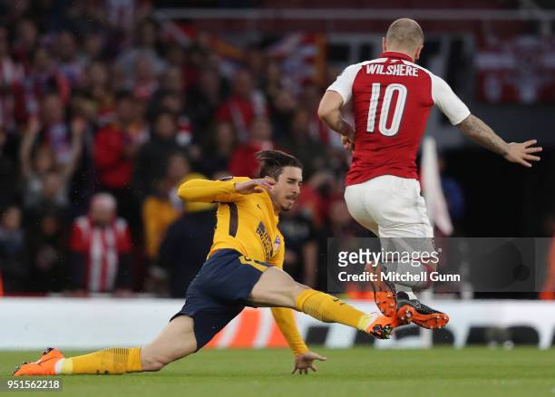 Sime Vrsaljko of Atletico Madrid fouls Jack Wilshere of Arsenal during the Europa League semi final leg one match between Arsenal and Atletico Madrid...