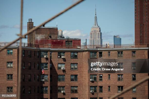 With the Empire State Building behind it, the Alfred E. Smith Houses, a public housing development built and maintained by the New York City Housing...