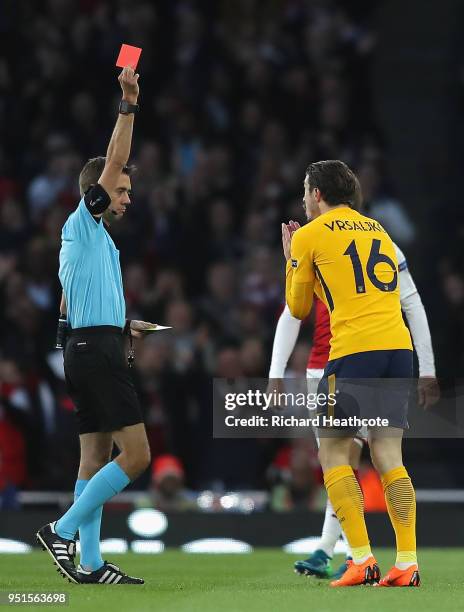 Sime Vrsaljko of Atletico Madrid is shown a red card during the UEFA Europa League Semi Final leg one match between Arsenal FC and Atletico Madrid at...