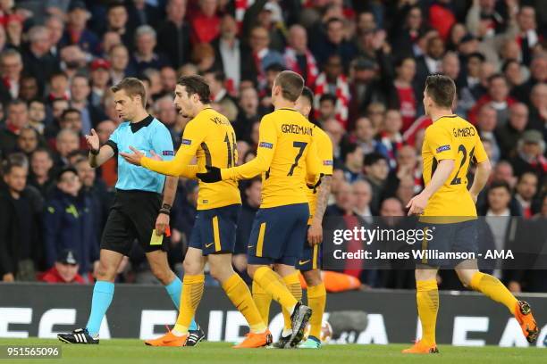 Sime Vrsaljko of Atletico Madrid protests to match referee Clement Turpin after being sent off during the UEFA Europa League Semi Final leg one match...