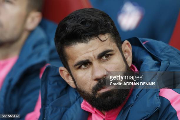 Atletico Madrid's Brazilian-born Spanish striker Diego Costa looks on from the bench before the UEFA Europa League first leg semi-final football...