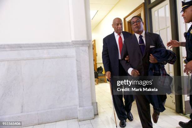 Bill Cosby departs the Montgomery County Courthouse with his publicist, Andrew Wyatt, after being found guilty on all counts in his sexual assault...