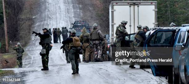 Dozens of area agency police officers dressed in armor and carrying assault weapons converged on the Bear Mountain Road off the Martin Stream Road in...