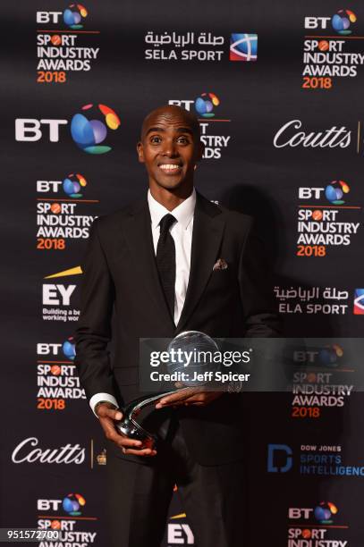Sir Mo Farah pose for a photo with his Coutts Outstanding Contribution to Sport Award during the BT Sport Industry Awards 2018 at Battersea Evolution...