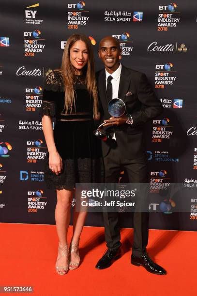 Sir Mo Farah and his wife Tania Nell pose for a photo after Mo Farah received his Coutts Outstanding Contribution to Sports Award during the BT Sport...