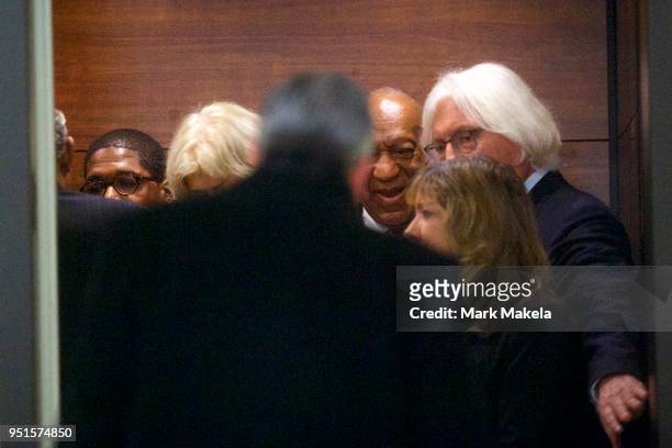 Bill Cosby descends an elevator with his attorneys, Kathleen Bliss and Tom Mesereau , at the Montgomery County Courthouse after being found guilty on...