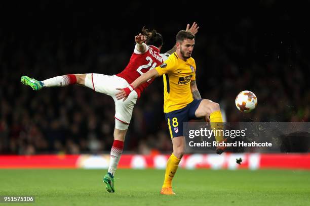 Saul Niguez of Atletico Madrid and Hector Bellerin of Arsenal in action during the UEFA Europa League Semi Final leg one match between Arsenal FC and...