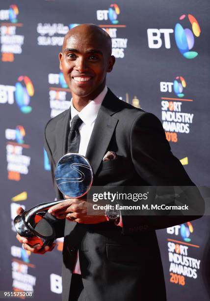 Sir Mo Farah poses for a photo with his Coutts Outstanding Contribution to Sport Award during the BT Sport Industry Awards 2018 at Battersea...