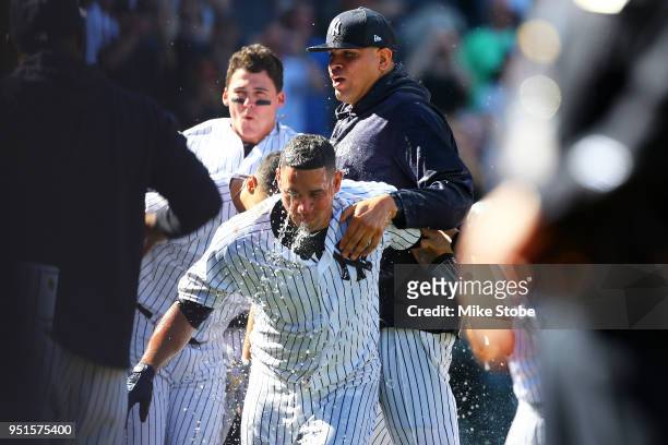 Gary Sanchez of the New York Yankees celebrates with Dellin Betances after hitting a walk-off three run home run in the bottom of the ninth inning...