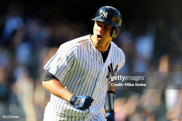 Gary Sanchez of the New York Yankees celebrates after hitting a walk-off three run home run in the bottom of the ninth inning against the Minnesota...