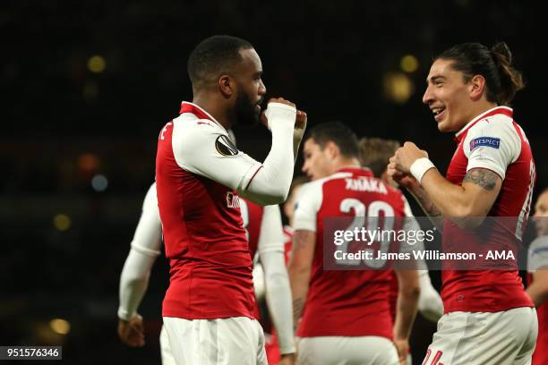 Alexandre Lacazette of Arsenal celebrates with Hector Bellerin of Arsenal after rumours of a training ground bust up earlier in the week after...