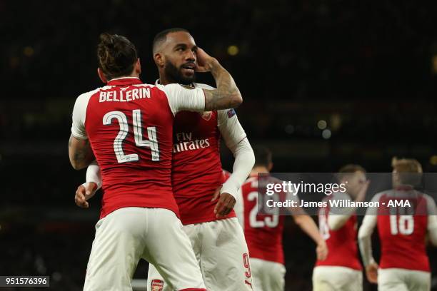 Alexandre Lacazette of Arsenal celebrates with Hector Bellerin of Arsenal after rumours of a training ground bust up earlier in the week after...