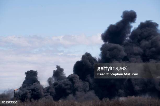 Smoke pours from a fire at the Husky Oil Refinery on April 26, 2018 in Superior, Wisconsin. Schools and a small hospital near the fire have been...