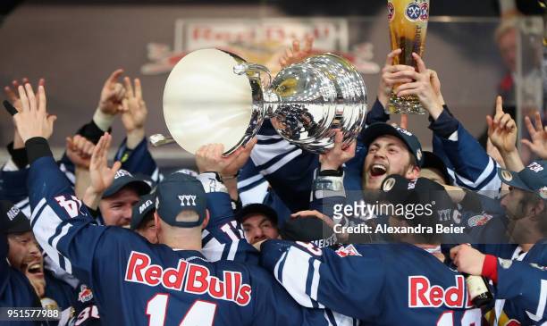Players of EHC Red Bull Muenchen celebrate their German Championship title after the DEL Play-offs Final Match 7 between EHC Red Bull Muenchen and...
