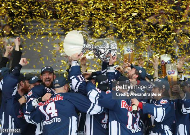 Players of EHC Red Bull Muenchen celebrate their German Championship title after the DEL Play-offs Final Match 7 between EHC Red Bull Muenchen and...