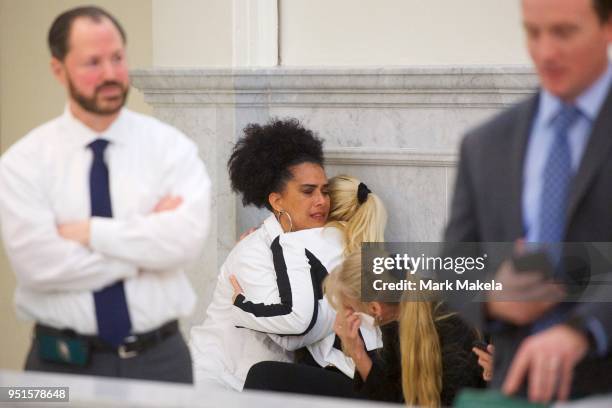 Bill Cosby accusers Lili Bernard and Caroline Heldman react after the guilty on all counts verdict was delivered in the sexual assault retrial at the...