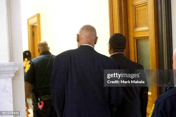 Bill Cosby walks through the Montgomery County Courthouse with his publicist, Andrew Wyatt, after being found guilty on all counts in his sexual...