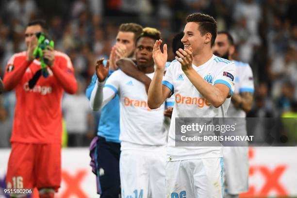 Marseille's French midfielder Florian Thauvin and team mates celebrate their victory at the end of the UEFA Europa League first-leg semi-final...