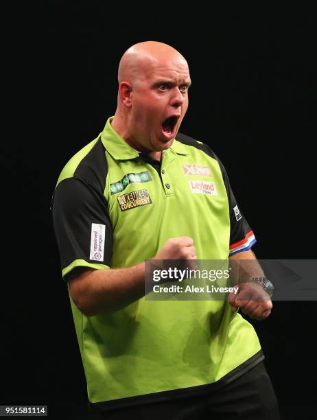 Michael van Gerwen celebrates during his match against Michael Smith in the 2018 Unibet Premier League at The Manchester Arena on April 26, 2018 in...