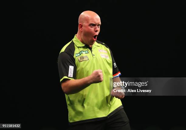 Michael van Gerwen celebrates during his match against Michael Smith in the 2018 Unibet Premier League at The Manchester Arena on April 26, 2018 in...