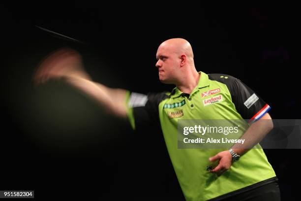 Michael van Gerwen in action during his match against Daryl Gurney in the 2018 Unibet Premier League at The Manchester Arena on April 26, 2018 in...