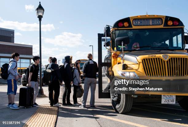 Students at the University of Wisconsin-Superior line up to load busses on April 26, 2018 in Superior, Wisconsin. The campus is being evacuated after...